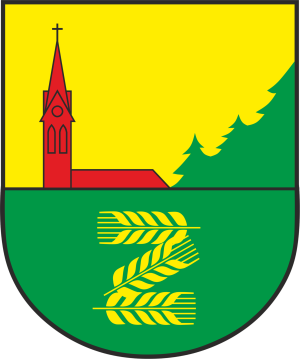 Herb Gminy Zblewo tarcza w kolorach żółtym i zielonym z wizerunkiem czerwonego kościoła oraz znakiem kłosy zboża
